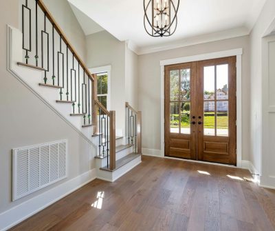 foyer with coach light, chandelier, light cleaning